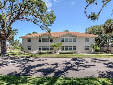 Multi-Gathering home with a red tile roof and neatly maintained landscaping at 528 W Venice Ave # 1, Venice, FL 34285