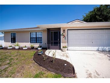Charming single-story home featuring a well-manicured lawn and attached two car garage at 552 Bellaire Dr, Venice, FL 34293