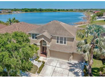Stunning two-story home with a three car garage and lake view at 632 Tanana Fall Dr, Ruskin, FL 33570