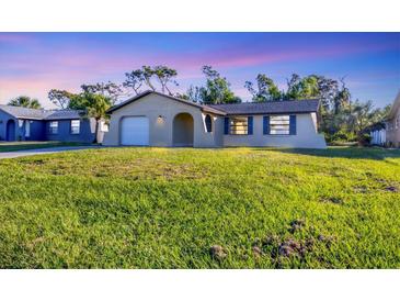Charming single-Gathering home with a well-maintained lawn and attached one car garage at 1032 Elaine St, Venice, FL 34285