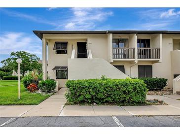 Charming two-story condo featuring a private entrance and well-maintained landscaping at 4646 Longwater Chase # 98, Sarasota, FL 34235