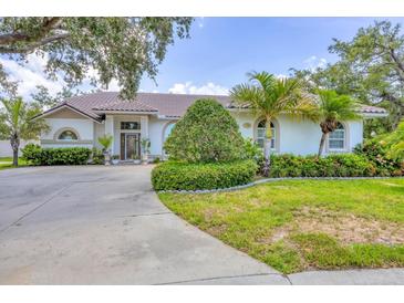 Beautiful single story home featuring lush landscaping and a long driveway at 188 Grand Oak Cir, Venice, FL 34292