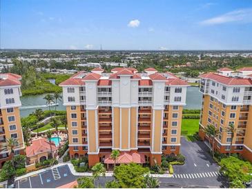 Stunning building view, showing landscaping, pool, and boat dock at 157 Tampa E Ave # 305, Venice, FL 34285