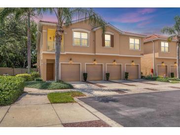 Charming townhome with a private garage and a cozy balcony surrounded by lush landscaping at 3633 Parkridge Cir # 10-201, Sarasota, FL 34243
