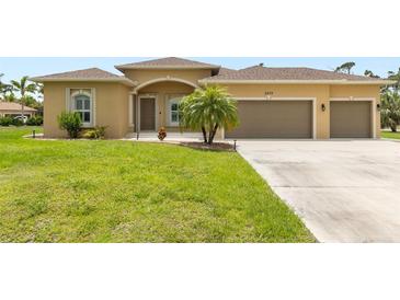 Well maintained single-Gathering home with manicured lawn and two car garage in a residential neighborhood at 2479 Grandview Dr, North Port, FL 34288
