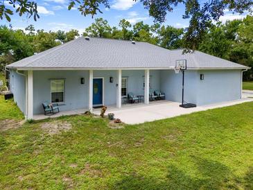 Charming single-story home featuring a basketball hoop and a spacious porch at 3863 Albin Ave, North Port, FL 34286