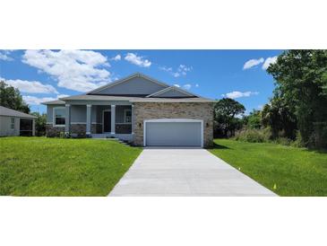 Beautiful two-story craftsman home with a stone facade at 5113 Hablow Ln, North Port, FL 34286