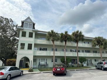 Green building exterior with parking at 2386 Sumatran Way # 26, Clearwater, FL 33763