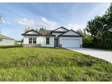 Photo one of 450 Troutdale St Port Charlotte FL 33954 | MLS O6189155