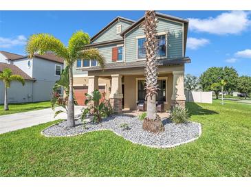 Two-story house with landscaped front yard at 8235 Bird Whistle Ln, Land O Lakes, FL 34637