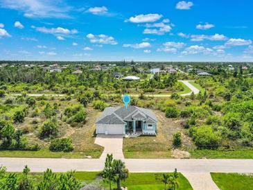 Aerial view of single-Gathering home and surrounding area at 9573 Shelburne Cir, Port Charlotte, FL 33981