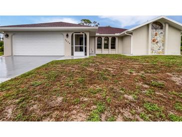 Charming single story home featuring a two-car garage and a well-manicured front yard at 3524 Cessna St, Port Charlotte, FL 33948