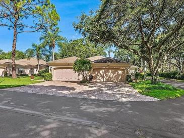 Charming single-Gathering home with two-car garage and manicured lawn at 5462 Chanteclaire # 65, Sarasota, FL 34235
