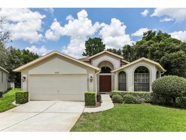 One-story home with attached garage and manicured lawn at 533 Bent Oak Ct, Spring Hill, FL 34609