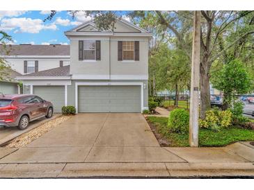 Two-car garage and front yard of townhome at 2111 Tetley Ct, Brandon, FL 33510