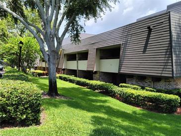 Building exterior with landscaping at 36750 Us Highway 19 N # 13-216, Palm Harbor, FL 34684