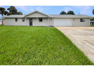 Newly renovated home with a two-car garage and spacious lawn at 1427 E Gate Dr, Venice, FL 34285