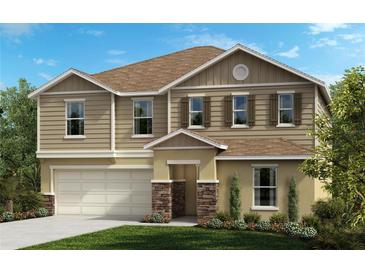 Two-story home with neutral siding and stone accents at 8025 Lennox Loop, Wesley Chapel, FL 33544