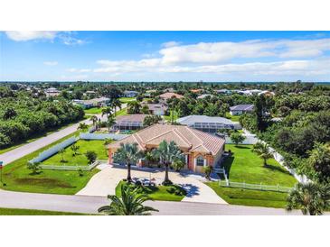 Single-Gathering home with pool and lush landscaping at 18065 Wing Ave, Port Charlotte, FL 33948