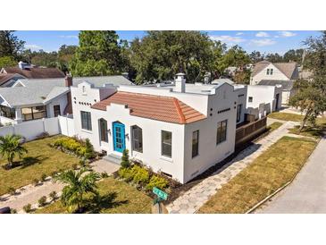 Updated Spanish-style home with a landscaped yard and driveway at 1101 22Nd N Ave, St Petersburg, FL 33704