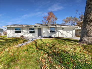 Newly renovated home with a large front yard at 290 Dragon Rd, Venice, FL 34293