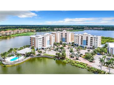 Aerial view of waterfront community, featuring resort-style amenities at 10530 Boardwalk Loop # 304, Lakewood Ranch, FL 34202