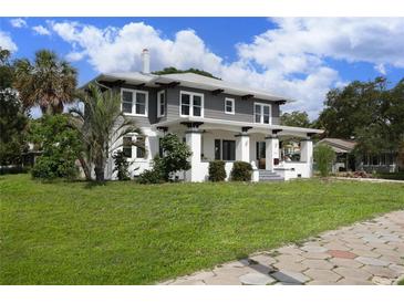 Two-story craftsman home with gray siding and white trim at 2041 Beach Dr Se, St Petersburg, FL 33705