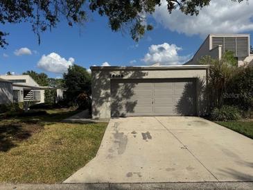 Single-Gathering home with attached garage and well-maintained landscaping at 13619 Twin Lakes Ln # 15, Tampa, FL 33618
