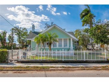 Charming light green house with white picket fence at 708 22Nd W St, Bradenton, FL 34205