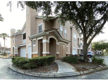 Inviting condo building exterior, landscaped grounds, and convenient parking at 10535 Villa View Cir # 2, Tampa, FL 33647