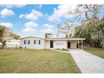Charming ranch home with a carport and well-maintained lawn at 205 Larson Ave, Brandon, FL 33510