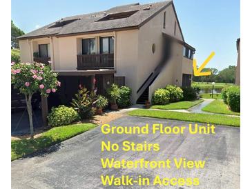 Charming two-story home features a ground floor unit, waterfront view, and direct access at 1322 Pelican Creek Xing # B, St Petersburg, FL 33707