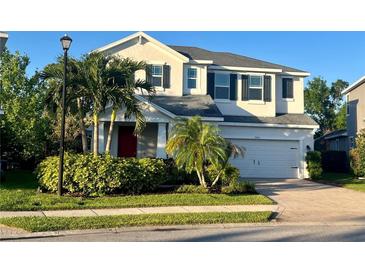 Charming two-story home with landscaped yard and a two car garage at 7480 Aguila Dr, Sarasota, FL 34240