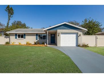 Charming single Gathering home with a well-maintained lawn and attached garage, offering curb appeal and convenience at 3207 33Rd Street W Ct, Bradenton, FL 34205