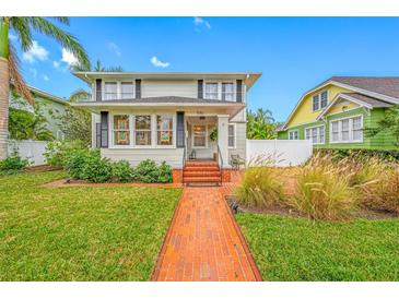 Charming home with a well-manicured lawn and inviting brick pathway at 546 15Th Ne Ave, St Petersburg, FL 33704