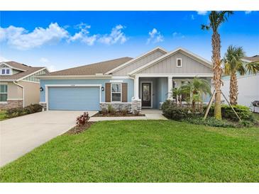 Charming single-story home showcasing a well-manicured lawn and inviting curb appeal at 31534 Westbury Estates Ave, Wesley Chapel, FL 33545