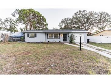 Charming single-story home with a well-maintained front yard and a concrete driveway at 2070 68Th S Ter, St Petersburg, FL 33712