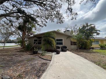 Charming single-story home with well-maintained landscaping and inviting front entrance at 4247 Helena Ne St, St Petersburg, FL 33703