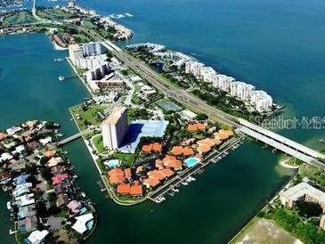 Stunning aerial view of waterfront community with lush landscaping and amazing water views at 4780 Brittany S Dr # 111, St Petersburg, FL 33715