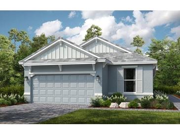 Charming single-story home featuring a two-car garage and a beautifully landscaped front yard, enhancing curb appeal at 3165 Alba Cir, Bradenton, FL 34211