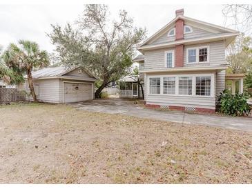 Charming two-story home with a detached garage and a spacious front yard at 8226 36Th N Ave, St Petersburg, FL 33710
