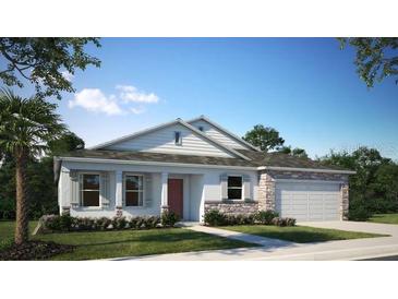 Charming single story home with stone accents, shutters, a two car garage and a beautiful landscaped yard at 2994 Alesio Ave, North Port, FL 34286
