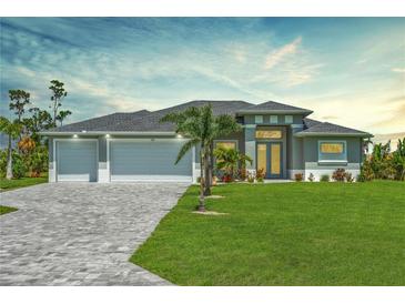 Charming home featuring a three-car garage, well-manicured lawn, and meticulously designed brick driveway at 291 Rotonda S Blvd, Rotonda West, FL 33947