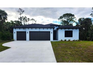 Charming single-story home featuring a two-car garage and a well-maintained lawn at 4313 Appleton Ter, North Port, FL 34286