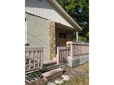 Charming home front entrance featuring decorative stone pillar and covered porch at 2918 E Waters Ave, Tampa, FL 33604