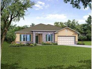Charming single-story home features stone accents, neutral tones, a well-manicured lawn, and a two car garage at 26170 Mindanao Ln, Punta Gorda, FL 33983