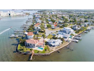 Waterfront property with boat docks nestled in a coastal community at 520 Baywood S Dr, Dunedin, FL 34698
