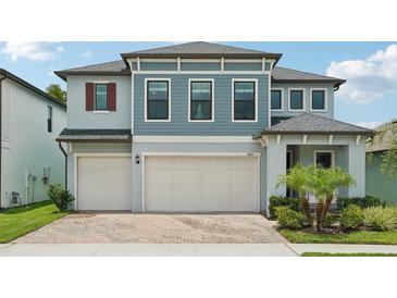Charming two-story home with a three-car garage and well-maintained landscaping at 8364 Capstone Ranch Dr, New Port Richey, FL 34655