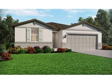 Charming single-story home featuring stone accents, an attached two-car garage, and a well-manicured front lawn at 237 Lazy Shore Dr, Nokomis, FL 34275