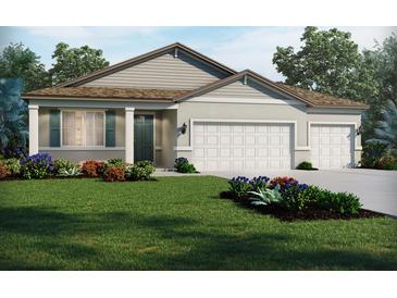 Charming single-story home featuring a two-car garage, well-manicured lawn, and colorful landscaping at 13839 Richland Gulf Cir, Parrish, FL 34219